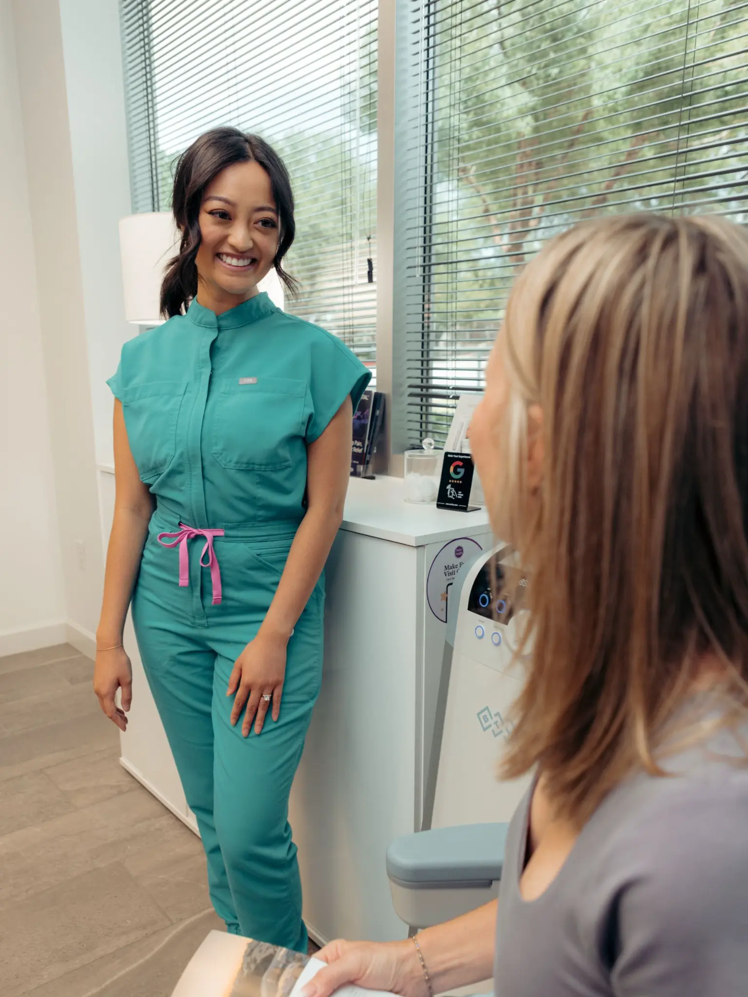 Helio Health and Wellness team member speaking with a patient during a personalized longevity consultation